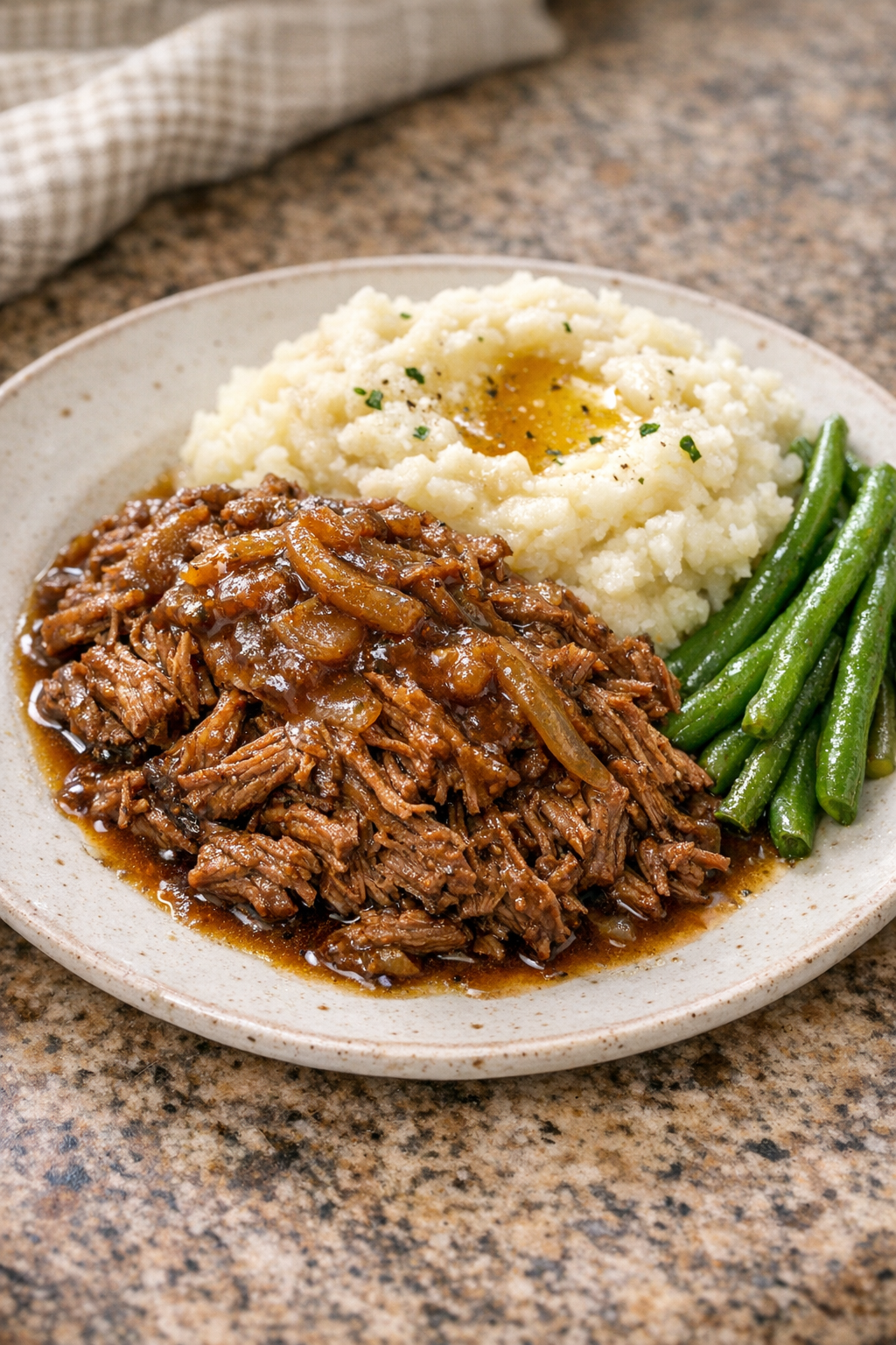 Finished Amish cola beef plated with its rich sauce