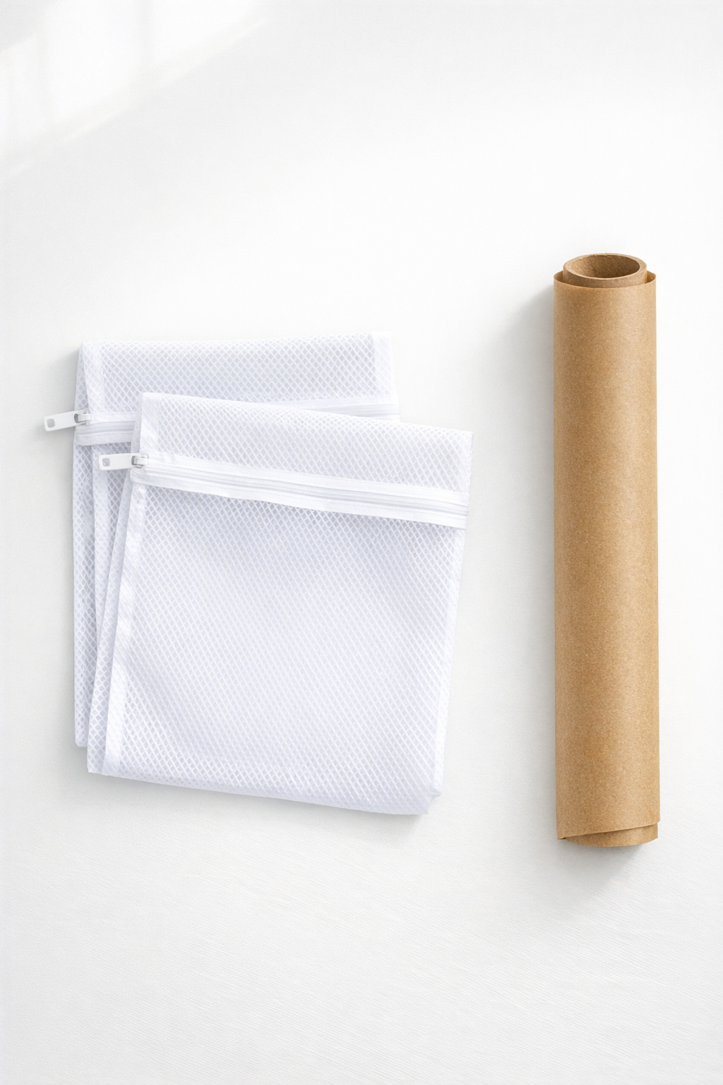Plastic mesh laundry bags and parchment paper laid out for the project