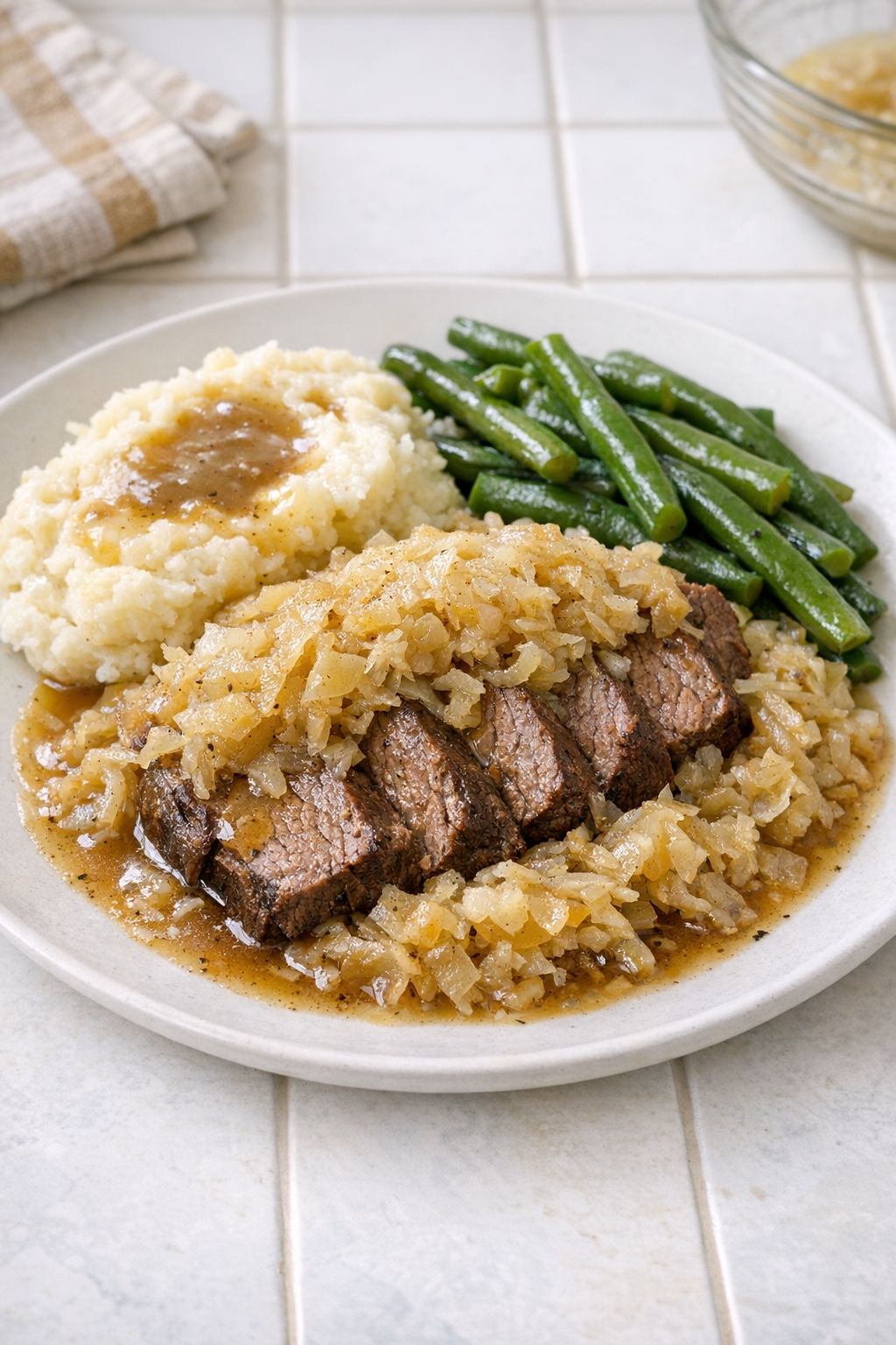 Finished Amish sauerkraut beef plated with tender slices and sauerkraut