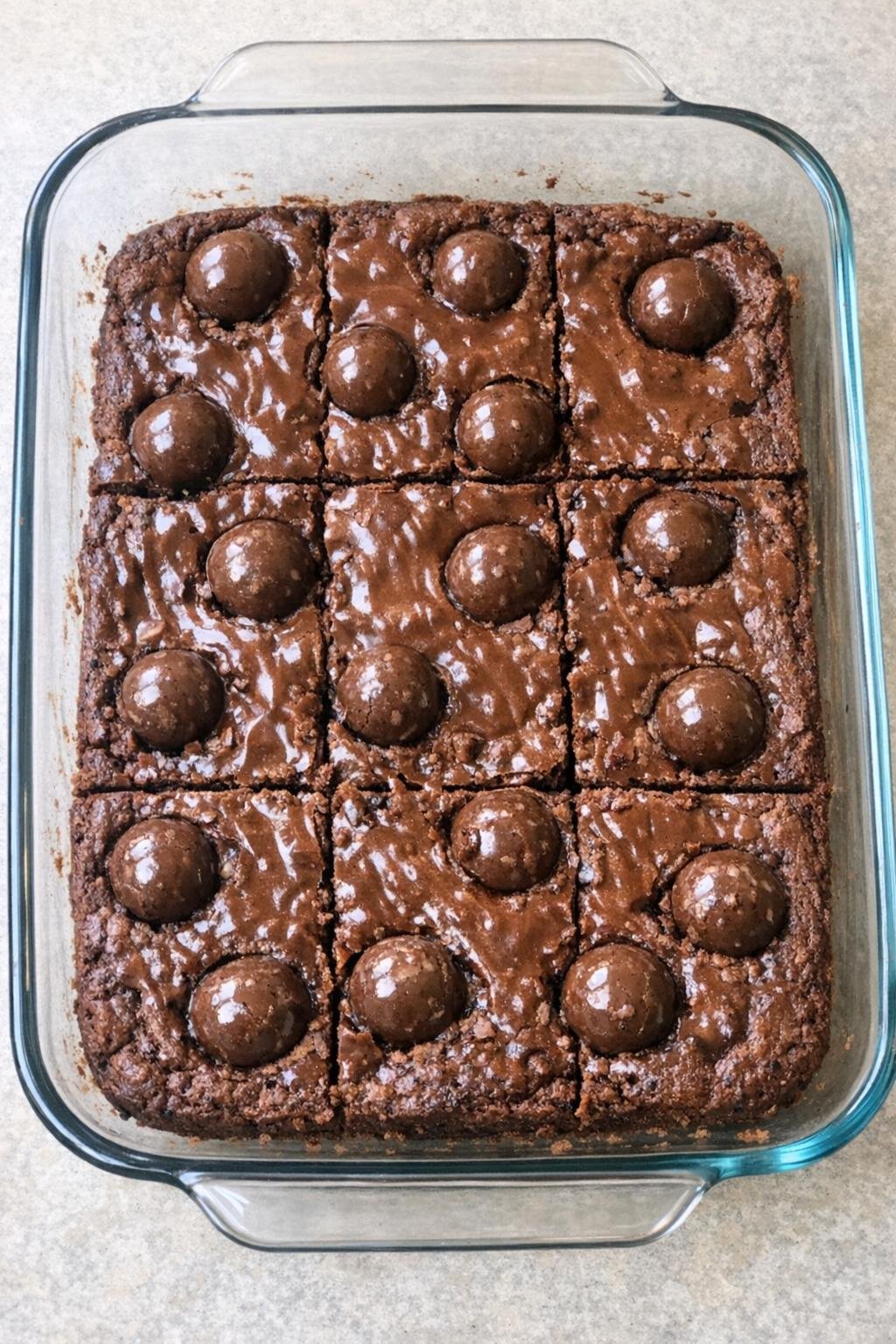 Finished malted milk chocolate bars in a glass baking dish