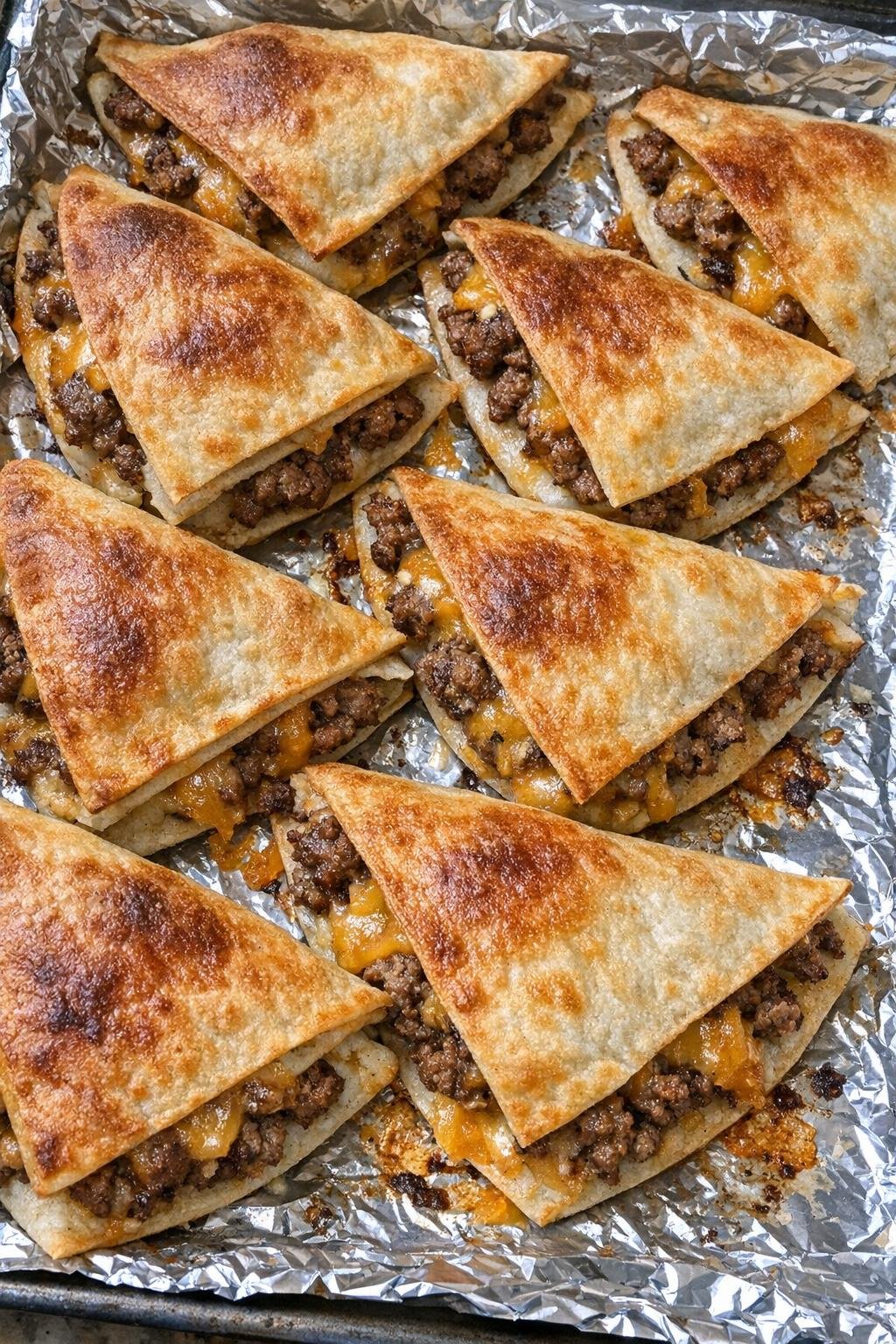 Crispy beef quesadilla wedges with melted cheddar